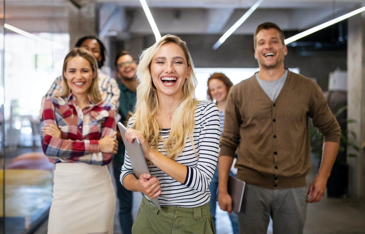 successful company with happy employees in modern office